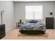 Well-lit bedroom offering a comfortable bed, dark furnishings, and soft, neutral carpeting at 212 Sweet Cherry Ln, Summerville, SC 29486