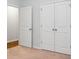 Bedroom features a closet with double doors and an doorway at 212 Sweet Cherry Ln, Summerville, SC 29486