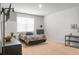 Comfortable bedroom with neutral carpet, simple decor, and ample natural light at 212 Sweet Cherry Ln, Summerville, SC 29486