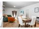 Cozy dining area adjacent to the living room, well-lit and perfect for Gathering meals and entertaining at 212 Sweet Cherry Ln, Summerville, SC 29486