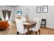 Dining area with hardwood floors and stylish decor with a dining table and four chairs at 212 Sweet Cherry Ln, Summerville, SC 29486
