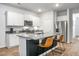 Modern kitchen featuring an island, stainless steel appliances, and ample cabinet space at 212 Sweet Cherry Ln, Summerville, SC 29486