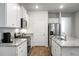 Modern kitchen featuring an island, stainless steel appliances, and ample cabinet space at 212 Sweet Cherry Ln, Summerville, SC 29486