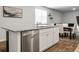 Kitchen island featuring stainless steel dishwasher and sink, overlooking the dining area at 212 Sweet Cherry Ln, Summerville, SC 29486