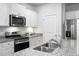 Well-lit kitchen featuring stainless steel appliances, granite countertops, and white cabinets at 212 Sweet Cherry Ln, Summerville, SC 29486
