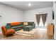 Inviting living room featuring a large sectional sofa, ottoman, and sliding glass doors at 212 Sweet Cherry Ln, Summerville, SC 29486