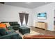 Relaxing living room with backyard access, contemporary furniture, and a sleek television setup at 212 Sweet Cherry Ln, Summerville, SC 29486