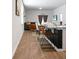 Modern open-concept living space with an island, seating, and a kitchen area with television at 212 Sweet Cherry Ln, Summerville, SC 29486