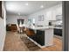 Modern open-concept living space with kitchen island, seating, and decor at 212 Sweet Cherry Ln, Summerville, SC 29486