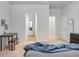 Bright main bedroom features neutral walls, walk-in closet, table, and gray bedspread at 212 Sweet Cherry Ln, Summerville, SC 29486