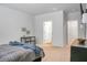 Bright main bedroom features neutral walls, walk-in closet, table, and gray bedspread at 212 Sweet Cherry Ln, Summerville, SC 29486