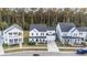 Aerial view of a home with a manicured lawn and a stunning tree-lined backdrop at 217 Woodland Oak Way, Summerville, SC 29485