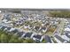 An aerial view shows neatly arranged homes in a well-maintained neighborhood at 217 Woodland Oak Way, Summerville, SC 29485