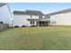 Spacious backyard with a screened-in porch and outdoor dining area, perfect for entertaining at 217 Woodland Oak Way, Summerville, SC 29485
