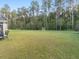 Expansive backyard with green grass, ideal for outdoor activities, complete with soccer and lacrosse goals at 217 Woodland Oak Way, Summerville, SC 29485
