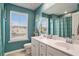This bathroom has a double sink vanity and a window that brings in lots of natural light at 217 Woodland Oak Way, Summerville, SC 29485