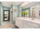 Bright bathroom featuring double sinks, decorative mirrors, and a stylish design at 217 Woodland Oak Way, Summerville, SC 29485