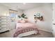 Cozy bedroom with a patterned comforter, white dresser, and a bright window at 217 Woodland Oak Way, Summerville, SC 29485