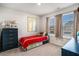 Comfortable bedroom featuring a colorful comforter, decor, and lots of natural light at 217 Woodland Oak Way, Summerville, SC 29485