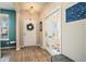 Elegant entryway with hardwood floors, stylish lighting, and decorative accents at 217 Woodland Oak Way, Summerville, SC 29485