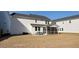 Rear exterior showing a screened-in porch and patio on a well-maintained lawn at 217 Woodland Oak Way, Summerville, SC 29485