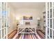 Bright home office with French doors, a striped rug, and ample natural light at 217 Woodland Oak Way, Summerville, SC 29485