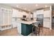 Modern kitchen with white cabinetry, stainless steel appliances, and a central island with seating at 217 Woodland Oak Way, Summerville, SC 29485