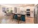 Bright kitchen with a central island, bar stool seating, and an adjacent dining area at 217 Woodland Oak Way, Summerville, SC 29485