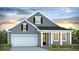 Charming single-Gathering home featuring a two-car garage and inviting front porch with white columns at 2254 Macallan Blvd, Ravenel, SC 29470