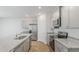 Well-lit kitchen featuring modern stainless steel appliances, granite countertops, and gray cabinets at 2254 Macallan Blvd, Ravenel, SC 29470