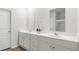 Bright bathroom features double vanity, white cabinets, and a large mirror at 2278 Macallan Blvd, Ravenel, SC 29470