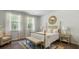 Serene bedroom with soft natural light, neutral tones, and classic furnishings at 2278 Macallan Blvd, Ravenel, SC 29470