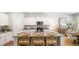 Bright kitchen boasts white cabinets, granite countertops, and stainless steel appliances at 2278 Macallan Blvd, Ravenel, SC 29470