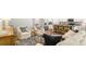 Open-concept living room with kitchen and dining areas at 2278 Macallan Blvd, Ravenel, SC 29470