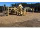 A brand-new playground with a wooden structure on top of mulch for the enjoyment of community members at 2278 Macallan Blvd, Ravenel, SC 29470
