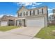 Charming two-story home with a welcoming front yard and a two-car garage, enhanced by black shutters and updated siding at 231 Hayworth Rd, Summerville, SC 29486