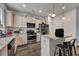Bright kitchen featuring granite countertops, stainless steel appliances, island with bar stool seating, and a modern design at 231 Hayworth Rd, Summerville, SC 29486