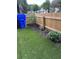 A fenced backyard with an area of fresh mulch and newly planted greenery at 2636 S Allen Dr # 2559 Accabee A & B, North Charleston, SC 29405
