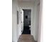 Hallway view into a modern bathroom with a sleek glass shower with black trim at 2636 S Allen Dr # 2559 Accabee A & B, North Charleston, SC 29405