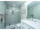 Stylish bathroom with a glass-enclosed tiled shower and a vanity with marble countertop at 2647 Tillman St, North Charleston, SC 29405