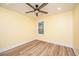 Bright bedroom features wood-look flooring, a modern ceiling fan, and a window for natural light at 2647 Tillman St, North Charleston, SC 29405