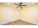 Bedroom with a ceiling fan, wood-look flooring, and a double-door closet at 2647 Tillman St, North Charleston, SC 29405