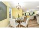 Inviting dining area with contemporary table set and natural light, open to the kitchen for easy serving at 2647 Tillman St, North Charleston, SC 29405