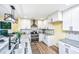 Contemporary kitchen with stainless appliances, sleek white cabinetry and a large island at 2647 Tillman St, North Charleston, SC 29405