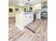 Modern kitchen with granite counters, stainless appliances, and light wood-look flooring at 2647 Tillman St, North Charleston, SC 29405