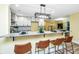 Elegant kitchen with white cabinetry and granite countertops, open to living area at 2647 Tillman St, North Charleston, SC 29405