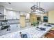 Bright kitchen with white cabinets, stainless appliances, granite countertops, and island seating at 2647 Tillman St, North Charleston, SC 29405