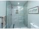 Modern shower with tiled walls, glass door, and built-in shelving at 2647 Tillman St, North Charleston, SC 29405