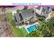 Aerial view of the home showcasing the pool, patio, screened-in porch, and lush backyard at 2900 Colonnade Dr, Mount Pleasant, SC 29466