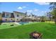 Spacious backyard featuring green grass, a pool, and patio furniture at 2900 Colonnade Dr, Mount Pleasant, SC 29466